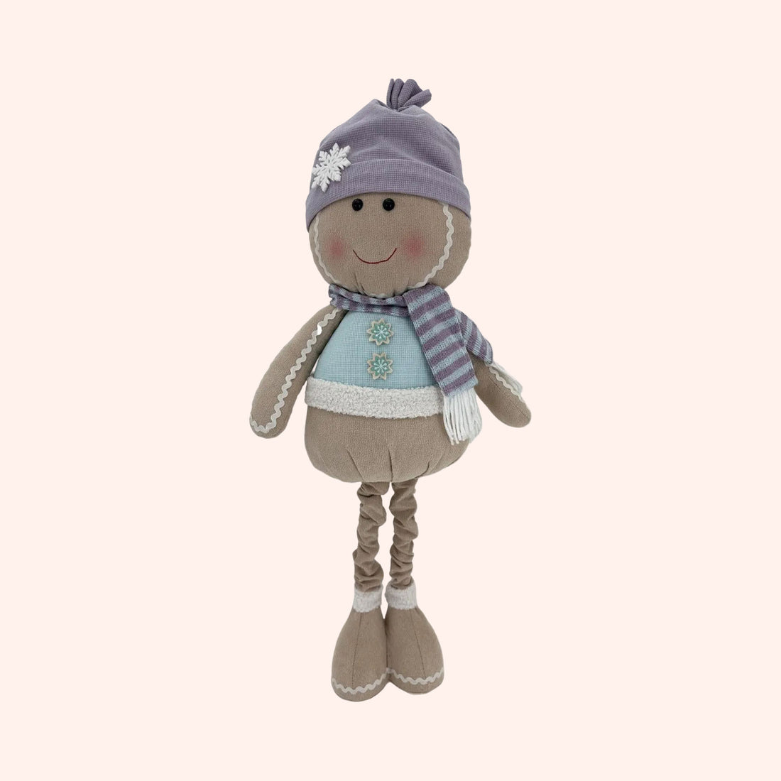 A plush winter-themed doll with a lavender knit hat, striped scarf, and light blue top, standing against a plain background.