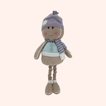 A plush winter-themed doll with a lavender knit hat, striped scarf, and light blue top, standing against a plain background.