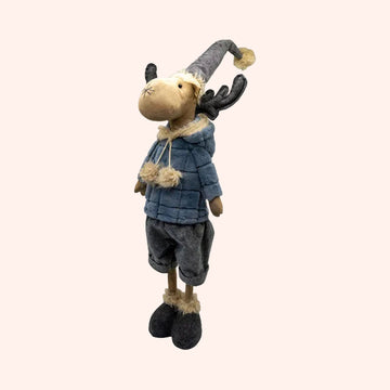 A plush moose decoration wearing a blue quilted jacket, gray pants, and a gray pointed hat with beige faux-fur trim, shown on a plain background.